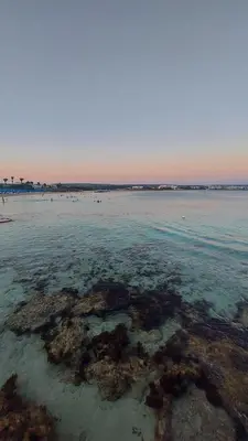 a large body of water with rocks and reefs at Pomelo Apartments in Ayia Napa