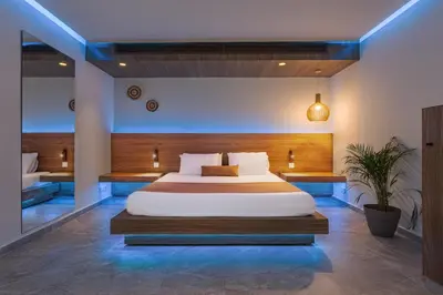 a bedroom with a large bed in a room at So White Beach Resort in Ayia Napa