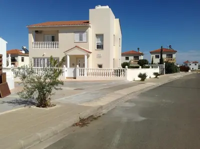 a white house on the side of a street at Villa Garmar CTO Approved 4487 in Paralimni