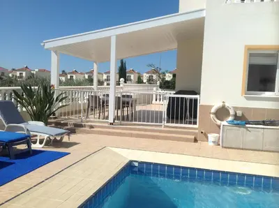 a house with a swimming pool and a patio at Villa Garmar CTO Approved 4487 in Paralimni