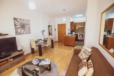 a living room with a couch and a table at Beach Haven in Larnaka
