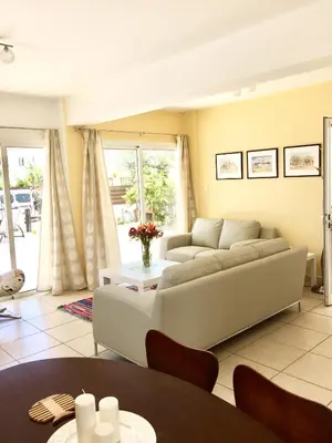 a living room with a couch and a table at Katerina in Ayia Napa