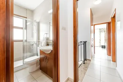 a bathroom with a toilet and a sink at Sea Front Oceanus H2 by Ezoria Villas in Ayia Napa