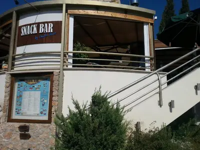a building with a sign that reads snack bar at Sunny Garden Limassol Star in Limassol