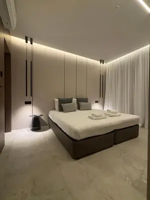 a bedroom with a large bed in a room at Tuck Inn in Larnaka