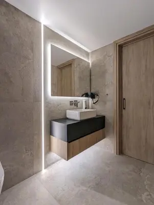 a bathroom with a sink and a mirror at Tuck Inn in Larnaka