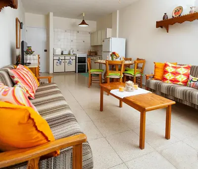 a living room with a couch and a table at Annita Court Bock B, Apt3 in Ayia Napa