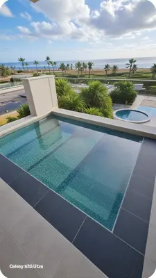 a swimming pool with a view of the ocean at Beachfront Luxury Villa Tranquility in Ayia Napa