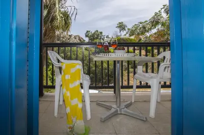 a table and two chairs on a balcony at Protaras Ayios Elias Suite in Protaras
