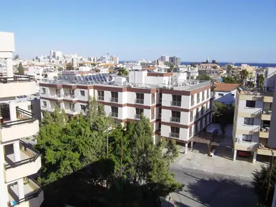 an aerial view of a city with buildings at Onisillos Hotel in Larnaka