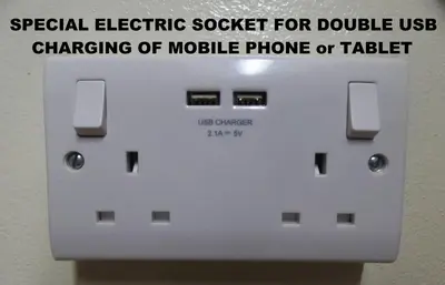 a sign that reads special electric socket for double usechanging of mobile phone or tablet at Metaxas Mansion in Kakopetria