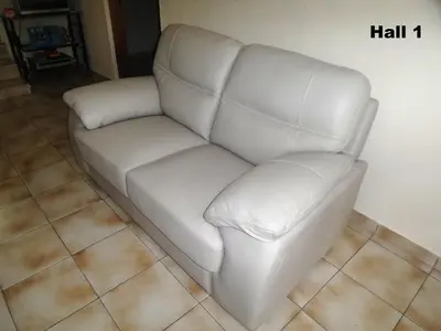 a white leather couch in a living room at Metaxas Mansion in Kakopetria