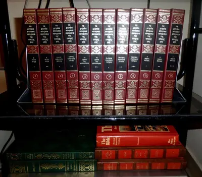 a stack of books sitting on a shelf at Metaxas Mansion in Kakopetria
