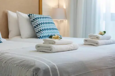 a hotel room with towels on a bed at Chris Le Mare Luxury Villa in Protaras