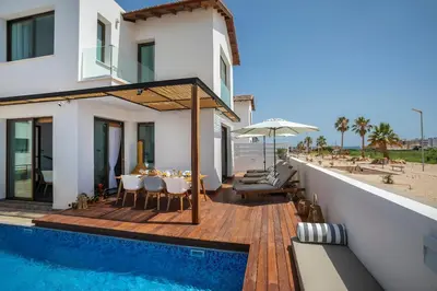 a villa with a swimming pool and a house at Chris Le Mare Luxury Villa in Protaras