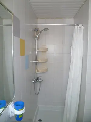 a bathroom with a shower with a shower curtain at Double room with ensuite bathroom at Datacom building in Nicosia