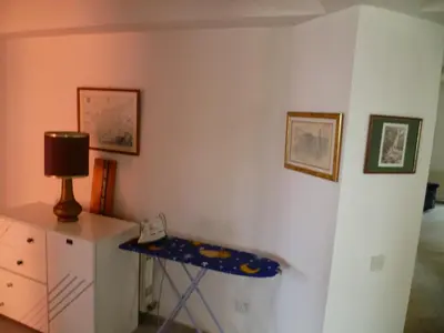 a room with a desk and a table with a lamp at Double room with ensuite bathroom at Datacom building in Nicosia