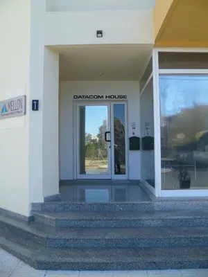 an entrance to a building with a glass door at Double room with ensuite bathroom at Datacom building in Nicosia