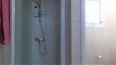 a shower with a glass door in a bathroom at Villa Kiveli in Ayia Napa