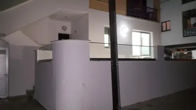a room with a staircase and a white wall at CHRIS'S HOLIDAY APT - AYIA NAPA in Ayia Napa
