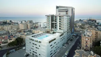 an overhead view of a city with a building at Radisson Blu Hotel, Larnaca in Larnaka