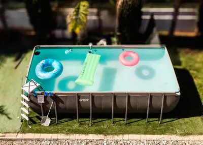 a table with an ipod on it in the grass at House of Nissus Hostel in Ayia Napa