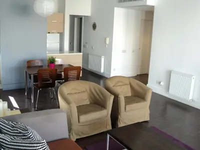 a living room with two chairs and a table at The Kapitani Residence in Nicosia