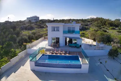 an aerial view of a house with a swimming pool at Aetopetra Villa in Protaras