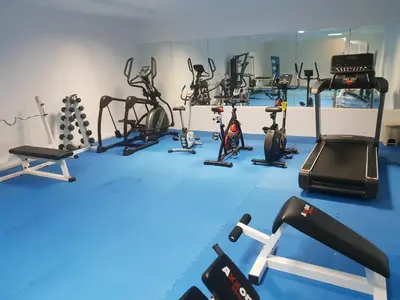 a gym with a bunch of exercise equipment in it at Evabelle Napa Hotel Apartments in Ayia Napa