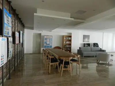 a room with a table and chairs and a couch at Evabelle Napa Hotel Apartments in Ayia Napa