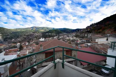 a view of a city from a balcony at Christys Palace Hotel in Pedoulas