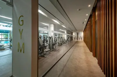 a gym with a row of treadmills and machines at Pavlo Napa Beach Hotel in Ayia Napa