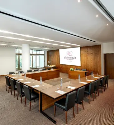 a large conference room with a long table and chairs at Pavlo Napa Beach Hotel in Ayia Napa