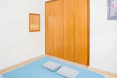 a room with two towels on a blue floor at MyNapa Apartments in Ayia Napa