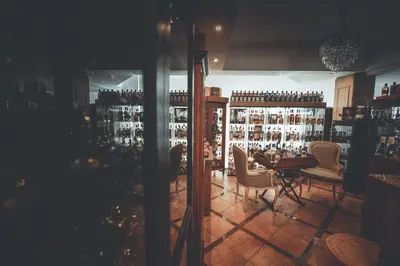 a restaurant with a table and chairs in a room at Chrielka Hotel in Limassol
