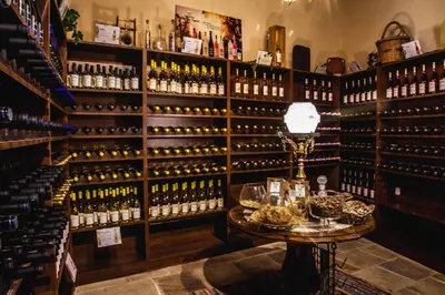 a room filled with lots of bottles of wine at Stou Kir Yianni in Omodos