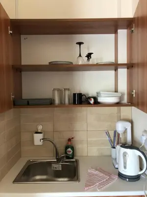 a kitchen counter top with a sink and a counter top at Lucky 4 in Paralimni