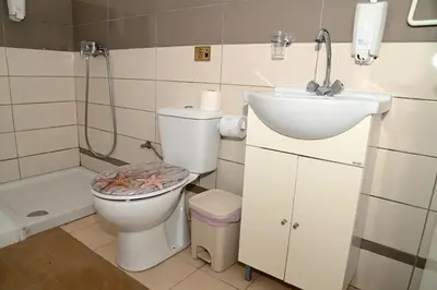 a bathroom with a toilet and a sink at Lucky 4 in Paralimni