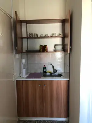 a small kitchen with a sink and a counter at Lucky 5 in Paralimni