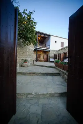 an open door to a building with a courtyard at Teacher's House in Maroni