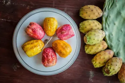 a plate of potatoes on a wooden table at Teacher's House in Maroni