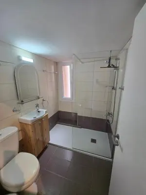 a bathroom with a shower and a toilet and a sink at Lazaros Centre Apartment in Larnaka
