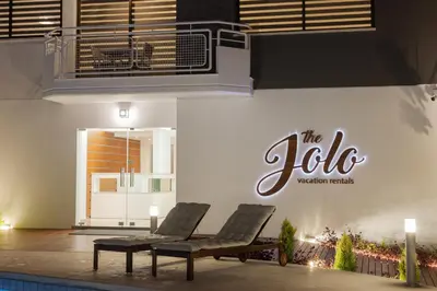 two chairs sitting in front of a building at The Jolo in Limassol