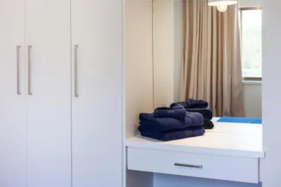 a pile of towels sitting on a counter in a room at The Jolo in Limassol