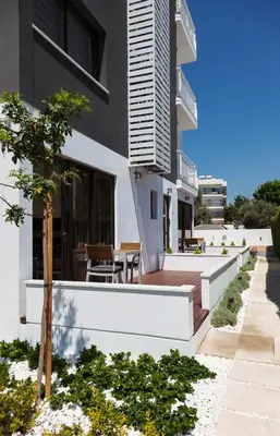 a house with a deck and a patio at The Jolo in Limassol
