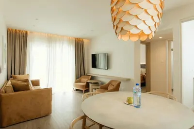 a living room with a table and a couch at Melissi Beach Hotel & Spa in Ayia Napa