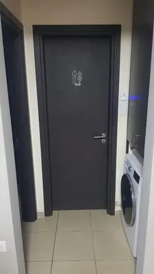 a black door with a sticker on it in a kitchen at Hermes complex1 paralimni in Paralimni