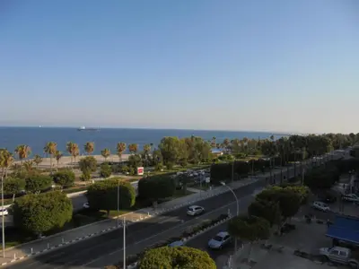 a city street with a road and the ocean at Kermia Court - Beach-front, modern 2 bedroom -sleeps 6 in Limassol