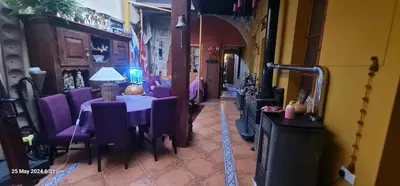 a dining room with a table and purple chairs at Petro's Antique House in Nicosia