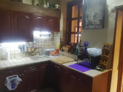 a kitchen with a sink and a counter top at Petro's Antique House in Nicosia